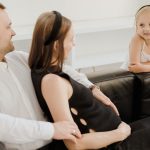 A loving family shares a tender moment, embracing joy and connection.